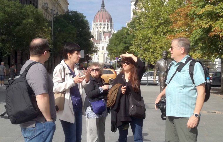 tour guide explaining something to guests