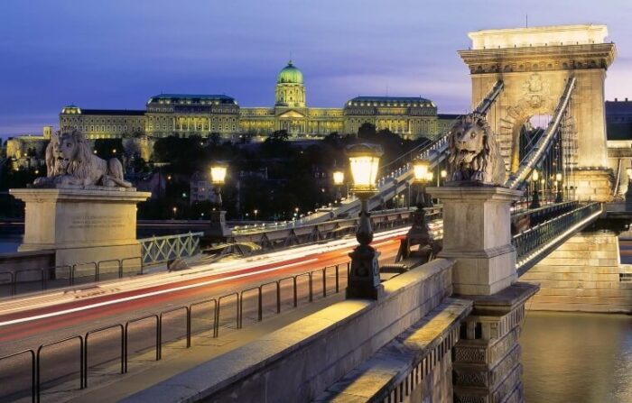 bridge across Danube lit up in the evening