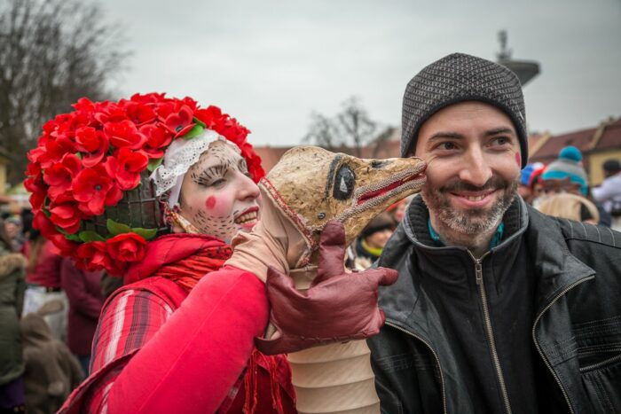 Two people in costume at a Masopust festival near Prague