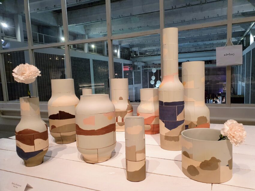 Several beige vases on a table at Designblok festival prague