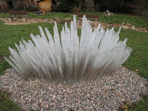 A white crystal sculpture by Jiří_Pačinek in a garden in the Czech Republic