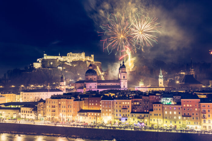 Colorful fireworks going off in the Old city of Salzburg and Festung Hohensalzburg at New Year's Eve.