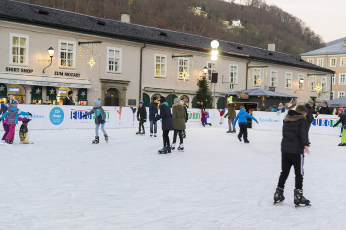 People skating on the ice rink on Mozart Square, Salzburg, Austria