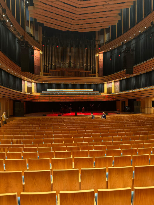 Müpa Budapest Concert Hall interior, with gold-brown seats facing the stage.