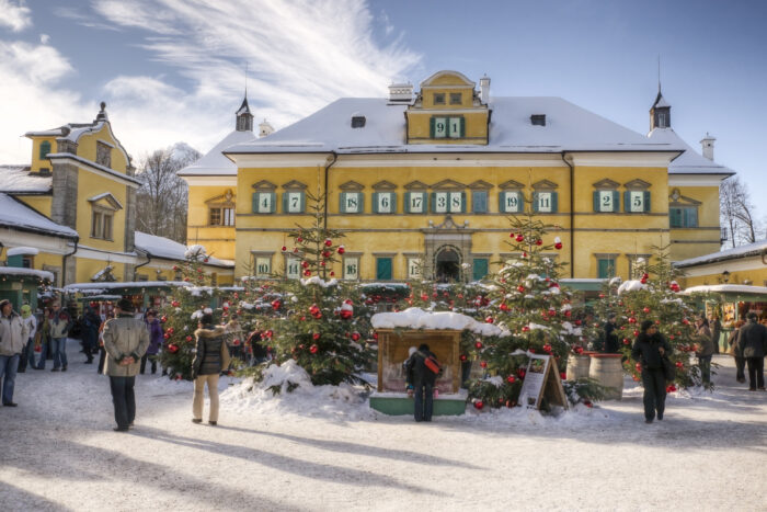 Christmas market in front of Hellbrunn Palace on a sunny December day