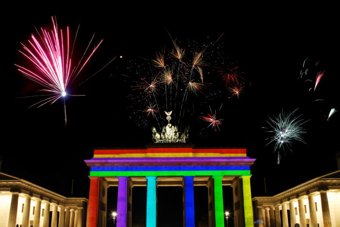 New Year's Eve at Brandenburger Gate in Berlin, Germany - the famous gate is specially illuminated inrainbow colors.