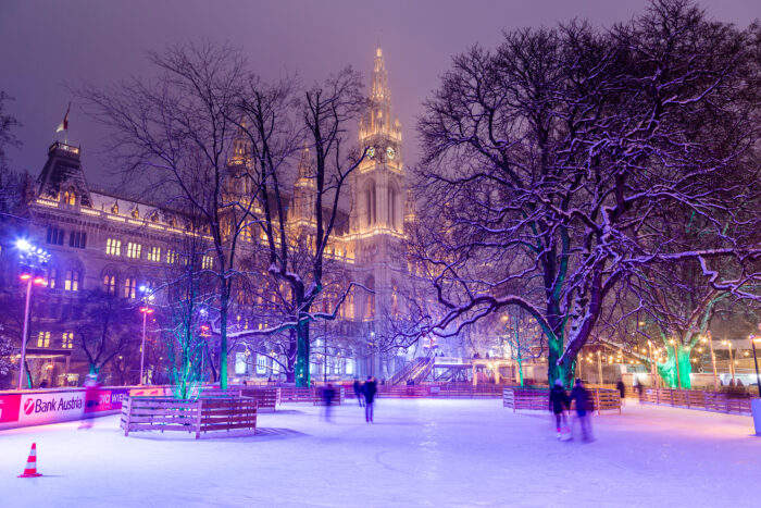 Wiener Eistraum (Vienna Ice World) at Rathausplatz in the winter. Rathaus (City Hall) can be seen in the distance.