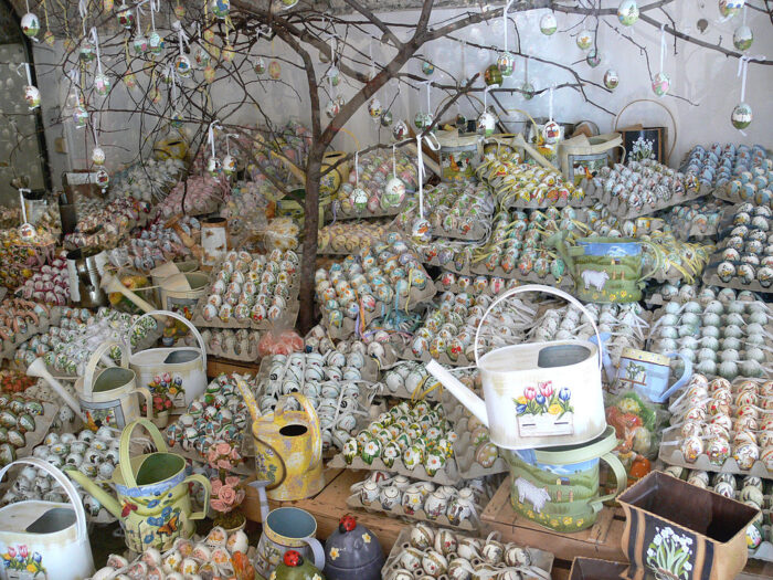 Assortments of decorated eggs and watering cans and decorated trees in Salzburg, Austria